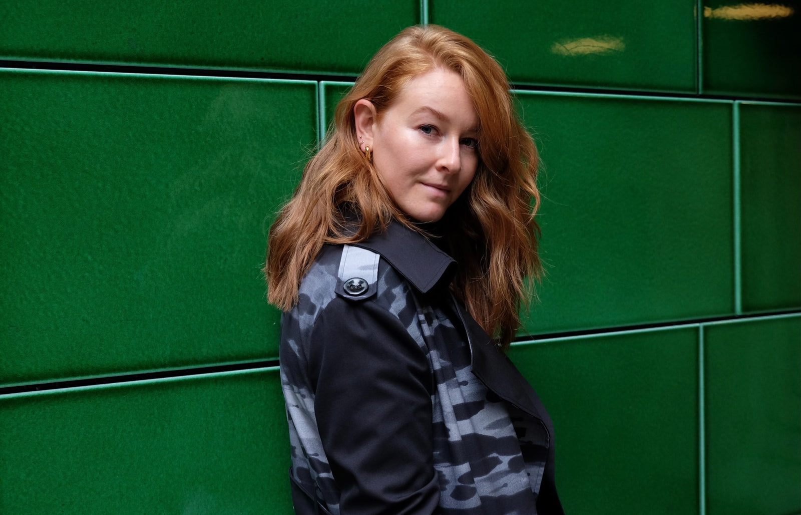 Megan Doyle wearing The Annie Trench Coat by Bastet Noir custom-made for her