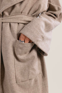 Beige wool blent coat with scarf-effect neckline and belt.