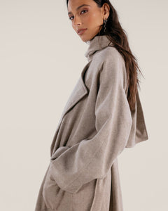 Beige wool blent coat with scarf-effect neckline and belt.