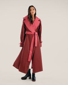 Reversible red or pink coat with detachable belt, front welt pockets and belted cuffs.