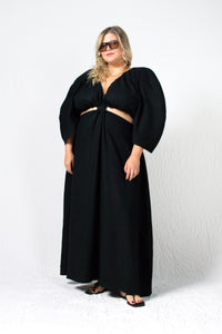 Black linen maxi dress with waist cut outs and deep V neckline