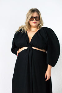 Black linen maxi dress with waist cut outs and deep V neckline