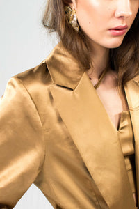 Gold silk satin blazer with structured silhouette and waist tie