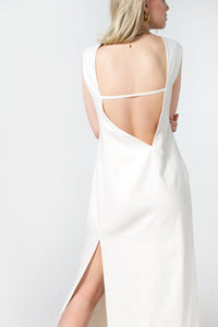 Cream white linen maxi dress with asymmetric open back and a high side slit
