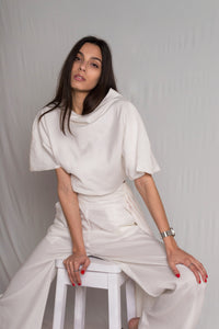 White top with cropped silhouette and a relaxed cowl neckline