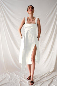 White midi dress with square neckline.
