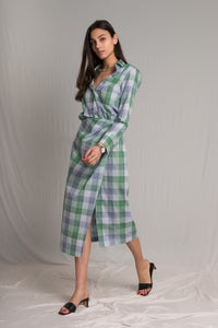 Plaid shirt dress with an elasticated waist and a side button closure a tight-high slit and an open V-neckline