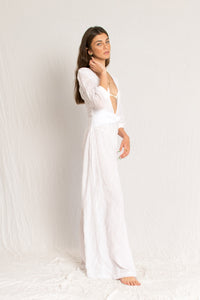 White sheer jumpsuit with sleeves, open V neckline and georgette silk lining