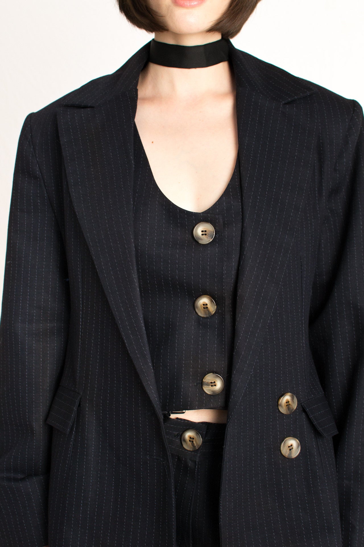 dark navy blue striped blazer with shoulder pads and front buttons