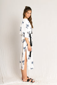 white midi palm tree print dress with side slits and peasant sleeves